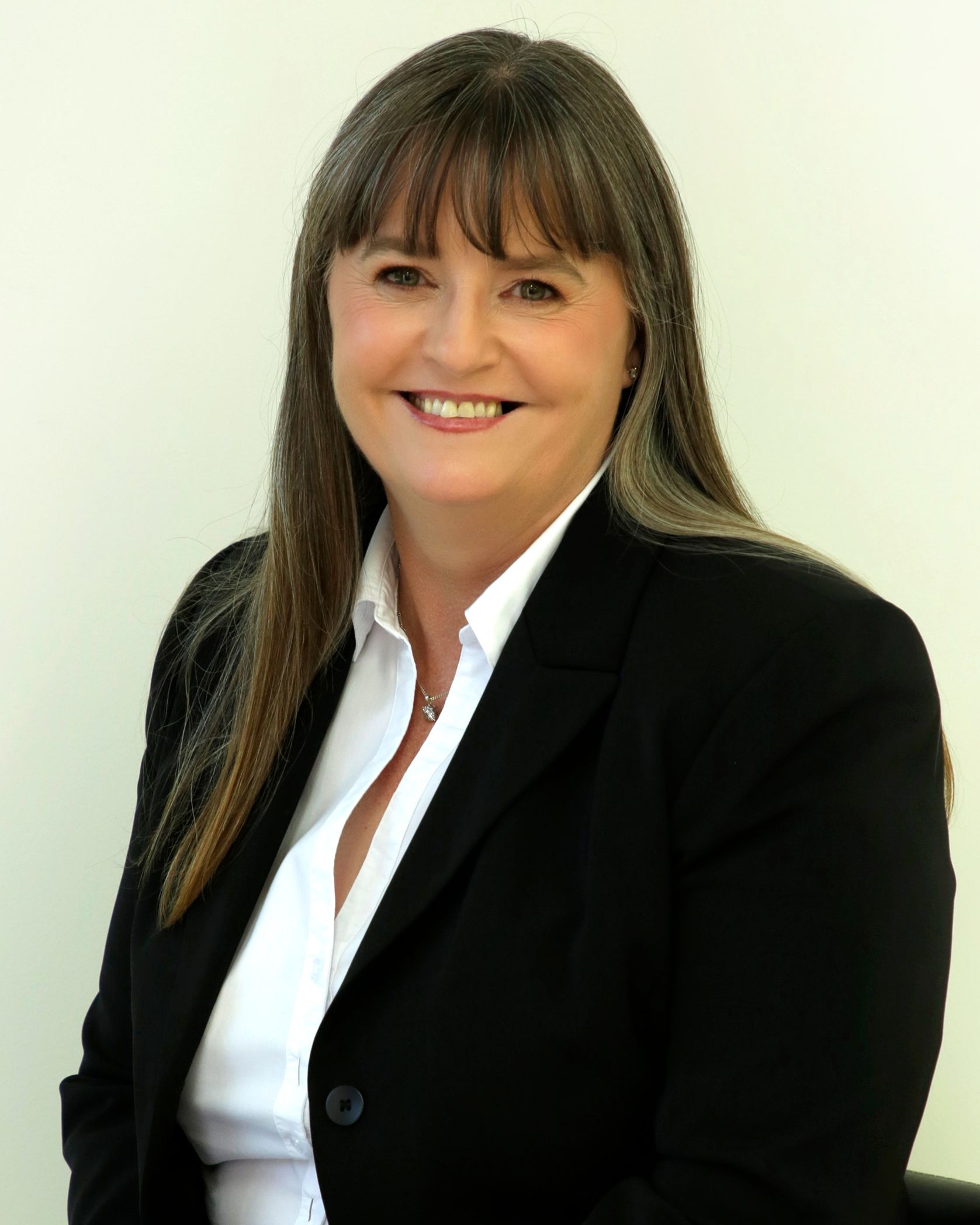 A portrait photograph of Kathy Coles.